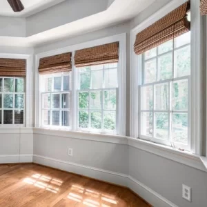 Bright living room featuring newly installed bay windows that enhance energy efficiency and natural light.